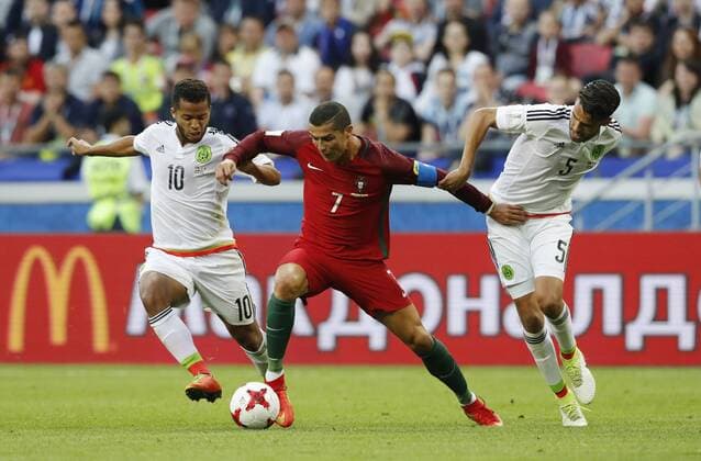 Portugal vs. Mexico KAZAN, RT - 18.06.2017: PORTUGAL VS. MEXICO - DOS SANTOS Giovani and REYES Diego of Mexico play for Cristiano Ronaldo of Portugal during a match between Portugal and Mexico valid for the first round of the Confederations Cup 2017 on Sunday (18) held at the Kazan Arena in Kazan, Russia. (Photo: Rodolfo Buhrer La Imagem Fotoarena) x1339429x  RodolfoxBuhrer
