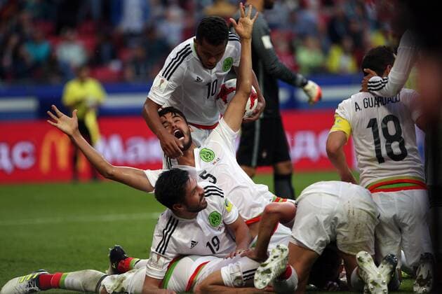 KAZAN, RUSSIA - JUNE 18, 2017: Mexico s Oribe Peralta (19), Diego Reyes (5), Giovani dos Santos (10), and Andres Guardado (18) celebrate a goal against Portugal in their 2017 FIFA Confederations Cup First Stage Group A football match at Kazan Arena Stadium; the match ended in a 2-2 draw. Yegor Aleyev TASS  TS053842