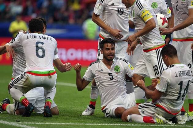 KAZAN, RUSSIA - JUNE 18, 2017: Mexico s Jonathan dos Santos (6), Diego Reyes (5), and Javier Hernandez (14) celebrate a goal against Portugal in their 2017 FIFA Confederations Cup First Stage Group A football match at Kazan Arena Stadium; the match ended in a 2-2 draw. Yegor Aleyev TASS  TS053848