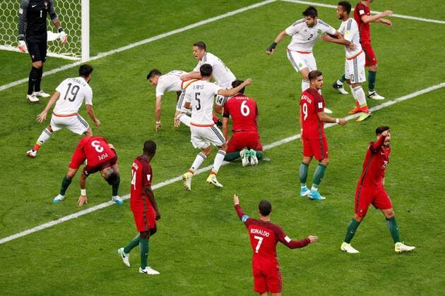 Soccer Football - Portugal v Mexico - FIFA Confederations Cup Russia 2017 - Group A - Kazan Arena, Kazan, Russia - June 18, 2017 MexicoÕs Hector Moreno celebrates scoring their second goal with team mates as Portugal players look dejected FOOTBALL : Portugal vs Mexique - Coupe Des Confederations - Kazan - 18 06 2017 ActionImages Panoramic  VPC_12