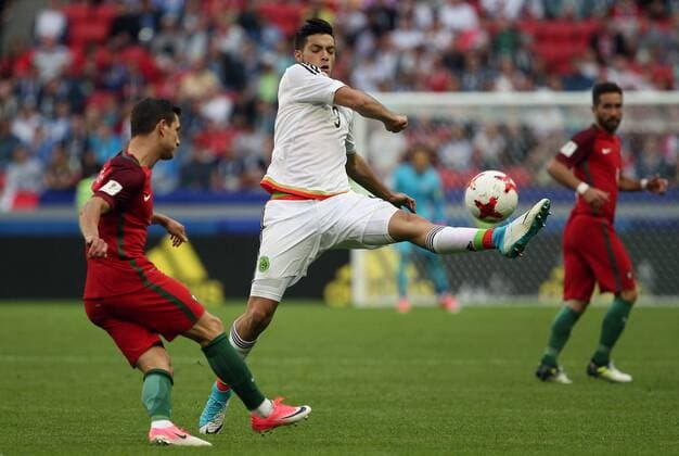 KAZAN, RUSSIA - JUNE 18, 2017: Mexico s Raul Jimenez (9), centre, kicks the ball in their 2017 FIFA Confederations Cup First Stage Group A football match against Portugal at Kazan Arena Stadium; the match ended in a 2-2 draw. Yegor Aleyev TASS  TS05381B