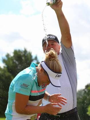 June 18, 2017 - Belmont, Michigan, United States - Brooke Henderson of Canada is sprayed with champagne by her father Dave Henderson during the final round of the Meijer LPGA Golf Damen Classic at Blythefield Country Club on June 18, 2017 in Grand Rapids, Michigan. Meijer LPGA Classic - Final Round  - ZUMAn230 20170618_zaa_n230_690 Copyright: xAmyxLemusx
