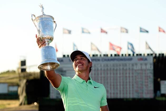 Brooks Koepka poses with the U.S. Open Trophy after the final round of the 117th U.S. Open golf tournament at Erin Hills golf course on June 18, 2017 in Erin, Wisconsin. Koepka shot a 16-under-par 272 to win the tournament by 4 strokes.  WIS20170618101 BRIANxKERSEY