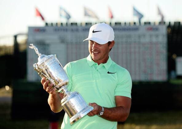 Brooks Koepka poses with the U.S. Open Trophy after the final round of the 117th U.S. Open golf tournament at Erin Hills golf course on June 18, 2017 in Erin, Wisconsin. Koepka shot a 16-under 272 to win the tournament by 4 strokes.  WIS20170618103 BRIANxKERSEY