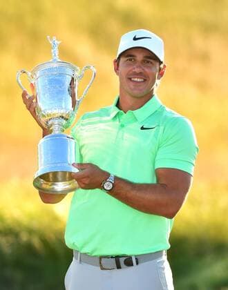Brooks Koepka poses with the trophy after winning the 117th U.S. Open golf tournament at Erin Hills golf course on June 18, 2017, in Erin, Wisconsin. Koepka posted a final score of 16-under-par.  WIS20170618309 KEVINxDIETSCH