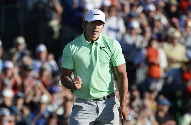 Brooks Koepka clenches his fist after putting out for par to win the 117th U.S. Open golf tournament at Erin Hill golf course with a 16-under-par total score on June 18, 2017, in Erin, Wisconsin.  WIS20170618566 BRIANxKERSEY