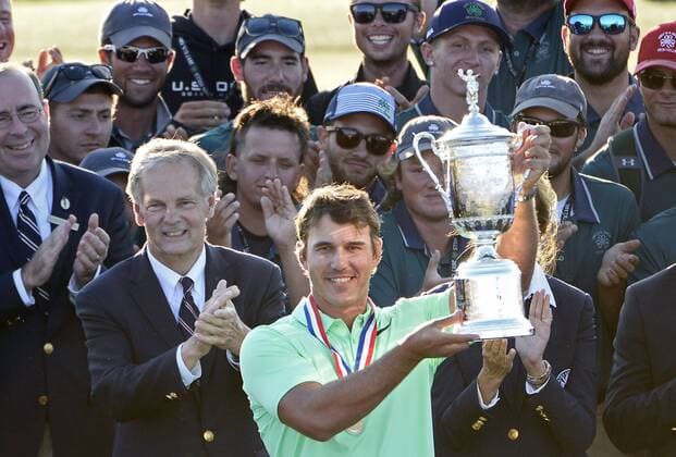 Brooks Koepka holds the trophy after his victory in the 117th U.S. Open golf tournament at Erin Hill golf course on June 18, 2017, in Erin, Wisconsin. Koepka posted a final score of 16-under-par.  WIS20170618579 BRIANxKERSEY
