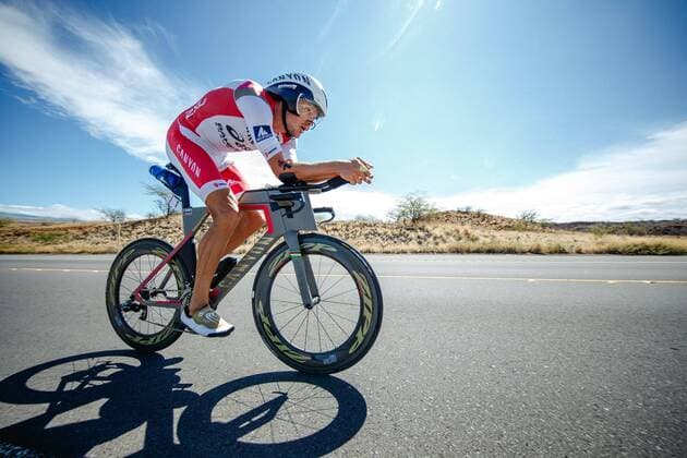 German triathlete defending champion Jan Frodeno races along the Queen K Highway on the way back from Hawi. Iron Man PhotoNews Panoramic 