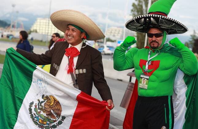 SOCHI, RUSSIA â€“ JUNE 21, 2017: Mexican fan wearing a sombrero waves a national flag ahead of the 2017 FIFA Confederations Cup Group B match against New Zealand at Fisht Stadium. Sergei Fadeichev TASS  TS054084