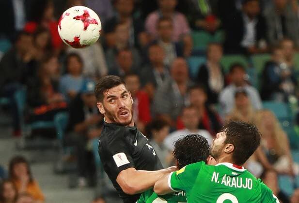 SOCHI, RUSSIA â€“ JUNE 21, 2017: New Zealand s Michael Boxall (L) and Mexico s Nestor Araujo fight for the ball in their 2017 FIFA Confederations Cup Group A match at Fisht Stadium. Sergei Fadeichev TASS  TS054173