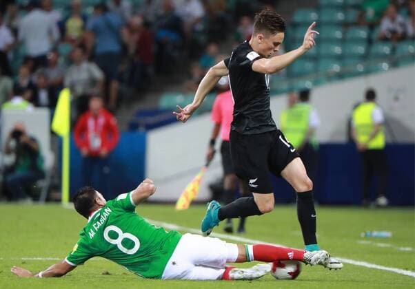 SOCHI, RUSSIA â€“ JUNE 21, 2017: Mexico s Marco Fabian (L) and New Zealand s Ryan Thomas fight for the ball in their 2017 FIFA Confederations Cup Group A match at Fisht Stadium. Sergei Fadeichev TASS  TS054177