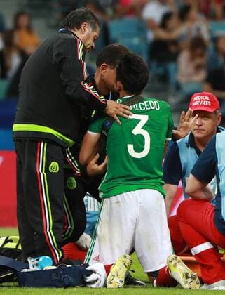 SOCHI, RUSSIA â€“ JUNE 21, 2017: Mexico s injured Carlos Salcedo receives medical aid during the 2017 FIFA Confederations Cup Group A match against New Zealand at Fisht Stadium. Sergei Fadeichev TASS  TS05418C