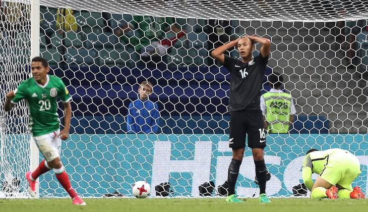 SOCHI, RUSSIA â€“ JUNE 21, 2017: New Zealand s goalkeeper Stefan Marinovic (R) concedes a goal in their 2017 FIFA Confederations Cup Group A match against Mexico at Fisht Stadium. Mexico won the game 2-1.Artyom Korotayev TASS  TS0541C7