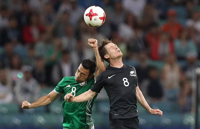 SOCHI, RUSSIA â€“ JUNE 21, 2017: Mexico s Marco Fabian (L) and New Zealand s Michael McGlinchey in action in their 2017 FIFA Confederations Cup Group A match at Fisht Stadium. Mexico won the game 2-1.Artyom Korotayev TASS  TS0541BC