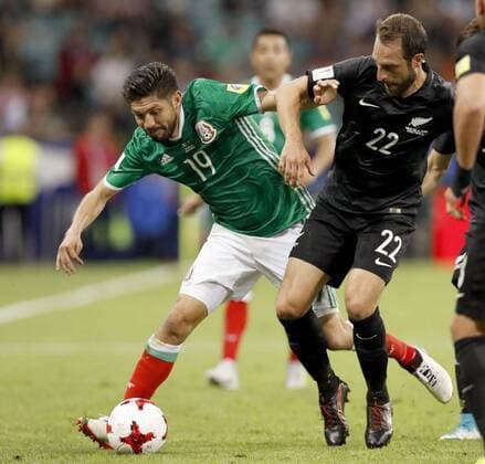 Soccer: Mexico come from behind to beat New Zealand 2-1 Oribe Peralta (L) of Mexico tries to hold off Andrew Durante of New Zealand during the first half of a Confederations Cup first-stage match in Sochi, Russia, on June 19, 2017. Mexico came from behind to win 2-1. 