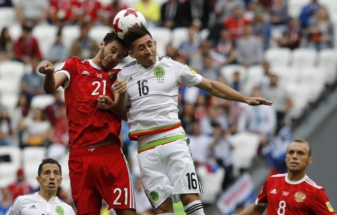 Mexico vs. Russia SAO PETERSBURGO, MO - 24.06.2017: MEXICO VS. RUSSIA - Aleksandr EROKHIN of Russia contests ball with HERRERA Hector of Mexico during a match between Mexico and Russia valid for the third round of the Confederations Cup 2017 on Saturday (24) held at Kazan Arena Stadium in Kazan, Russia. (Photo: Rodolfo Buhrer La Imagem Fotoarena) x1343470x  RodolfoxBuhrer