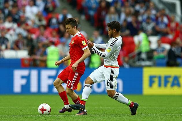 Mexico vs. Russia SAO PETERSBURGO, MO - 24.06.2017: MEXICO VS. RUSSIA - Jonathan Dos Santos of Mexico contests bid with Golovin Aleksandr of Russia during a match between Mexico and Russia valid for the third round of the Confederations Cup 2017, on Saturday (24), held at the Kazan Arena in Kazan, Russia. (Photo: Heuler Andrey DiaEsportivo Fotoarena) x1343519x  HeulerxAndrey