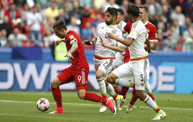 Mexico vs. Russia SAO PETERSBURGO, MO - 24.06.2017: MEXICO VS. RUSSIA - Fedor SMOLOV of Russia receives the foul from ARAUJO Nestor of Mexico during Mexico-Russia match valid for the third round of the Confederations Cup 2017 on Saturday (24) held at Kazan Arena Stadium in Kazan, Russia. (Photo: Rodolfo Buhrer La Imagem Fotoarena) x1343528x  RodolfoxBuhrer
