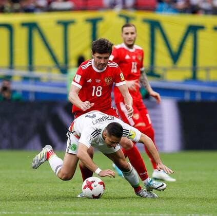 Mexico vs. Russia SAO PETERSBURGO, MO - 24.06.2017: MEXICO VS. RUSSIA - ZHIRKOV Yury of Russia commits foul on HERNANDEZ Javier of Mexico during a match between Mexico and Russia valid for the third round of the Confederations Cup 2017, this Saturday (24) held Arena Kazan in Kazan, Russia. (Photo: Marcelo Machado de Melo Fotoarena) x1343531x  MarceloxMachadoxdexMelo