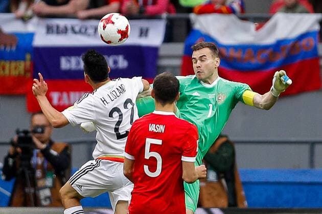 Mexico vs. Russia SAO PETERSBURGO, MO - 24.06.2017: MEXICO VS. RUSSIA - LOZANO Hirving of Mexico shares with AKINFEEV Igor of Russia to score goal during Mexico-Russia match valid for the third round of the Confederations Cup 2017 on Saturday (24) held Arena Kazan in Kazan, Russia. (Photo: Marcelo Machado de Melo Fotoarena) x1343540x  MarceloxMachadoxdexMelo