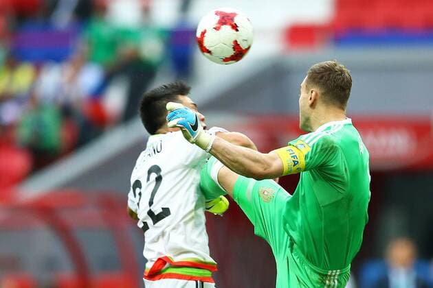 Mexico vs. Russia SAO PETERSBURGO, MO - 24.06.2017: MEXICO VS. RUSSIA - Hirving Lozano of Mexico contests bid with Akinfeev Igor of Russia during a match between Mexico and Russia valid for the third round of the Confederations Cup 2017 on Saturday (24) held at the Kazan Arena in Kazan, Russia. (Photo: Heuler Andrey DiaEsportivo Fotoarena) x1343545x  HeulerxAndrey