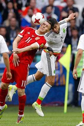 Mexico vs. Russia SAO PETERSBURGO, MO - 24.06.2017: MEXICO VS. RUSSIA - BUKHAROV Aleksandr of Russia contests ball with ARAUJO Nestor of Mexico during Mexico-Russia match valid for the third round of the Confederations Cup 2017 on Saturday (24) held Arena Kazan in Kazan, Russia. (Photo: Marcelo Machado de Melo Fotoarena) x1343563x  MarceloxMachadoxdexMelo