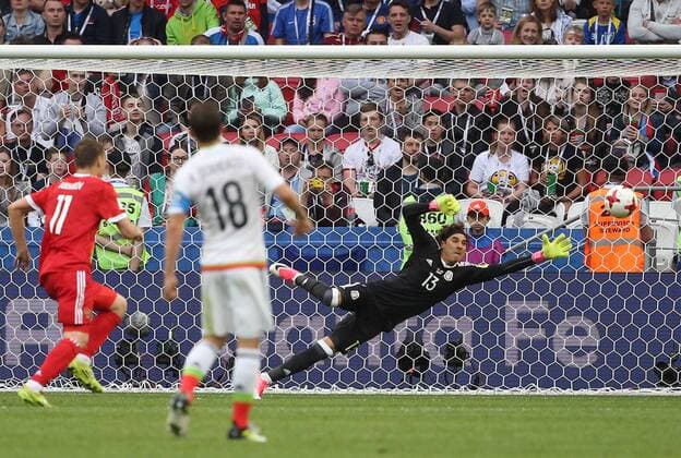 KAZAN, RUSSIA - JUNE 24, 2017: Mexico s goalkeeper Guillermo Ochoa (R back) concedes a goal to Russia in their 2017 FIFA Confederations Cup First Stage Group A football match at Kazan Arena Stadium; Mexico won the game 2-1. Yegor Aleyev TASS  TS0549FC