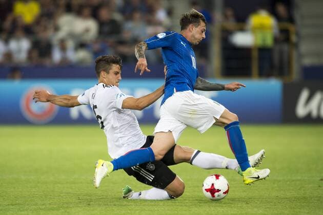 June 24, 2017 - Krakow, Poland - Federico Bernardeschi of Italy fouled by Marc-Oliver Kempf of Germany during the UEFA European Under-21 Championship 2017 Group C match between Italy and Germany at Krakow Stadium in Krakow, Poland on June 24, 2017 Italy v Germany - 2017 UEFA European Under-21 Championship  - ZUMAn230 20170624_zaa_n230_499 Copyright: xAndrewxSurmax