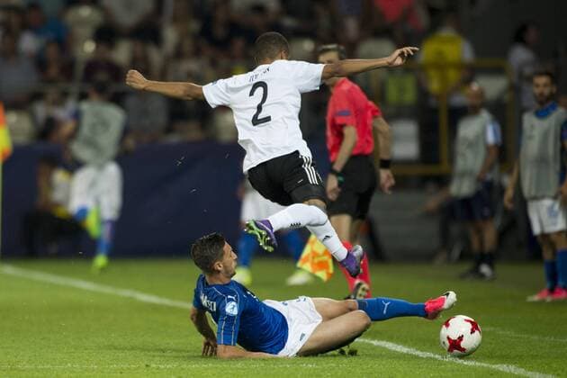 June 24, 2017 - Krakow, Poland - Jeremy Toljan of Germany tackled by Antonio Barreca of Italy during the UEFA European Under-21 Championship 2017 Group C match between Italy and Germany at Krakow Stadium in Krakow, Poland on June 24, 2017 Italy v Germany - 2017 UEFA European Under-21 Championship  - ZUMAn230 20170624_zaa_n230_509 Copyright: xAndrewxSurmax