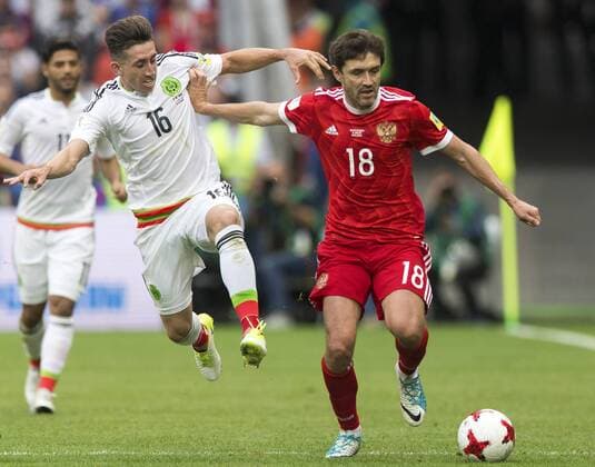 (170625) -- KAZAN, June 25, 2017 -- Hector Herrera(C) of Mexico vies with Yury Zhirkov(R) of Russia during group A match between Russia and Mexico at the 2017 FIFA Confederations Cup in Kazan, Russia, on June 24, 2017. Mexico won 2-1. ) (SP)RUSSIA-KAZAN-FIFA-CONFED CUP-RUS VS MEX BaixXueqi 