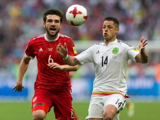 (170625) -- KAZAN, June 25, 2017 -- Javier Hernandez of Mexico vies with Georgy Dzhikya(L) of Russia during group A match between Russia and Mexico at the 2017 FIFA Confederations Cup in Kazan, Russia, on June 24, 2017. Mexico won 2-1. ) (SP)RUSSIA-KAZAN-FIFA-CONFED CUP-RUS VS MEX BaixXueqi 