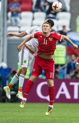 (170625) -- KAZAN, June 25, 2017 -- Alexander Bukharov (Front) of Russia heads the ball during group A match between Russia and Mexico at the 2017 FIFA Confederations Cup in Kazan, Russia, on June 24, 2017. Mexico won 2-1. ) (SP)RUSSIA-KAZAN-FIFA-CONFED CUP-RUS VS MEX EvgenyxSinitsyn 