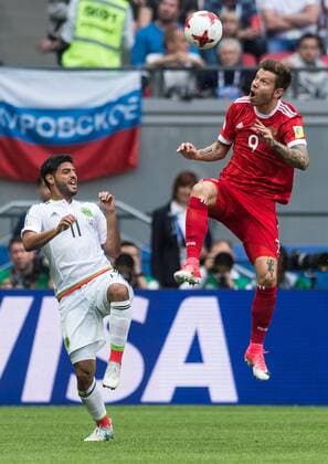 (170625) -- KAZAN, June 25, 2017 -- Fedor Smolov (R) of Russia vies with Carlos Vela of Mexico during group A match between Russia and Mexico at the 2017 FIFA Confederations Cup in Kazan, Russia, on June 24, 2017. Mexico won 2-1. ) (SP)RUSSIA-KAZAN-FIFA-CONFED CUP-RUS VS MEX EvgenyxSinitsyn 