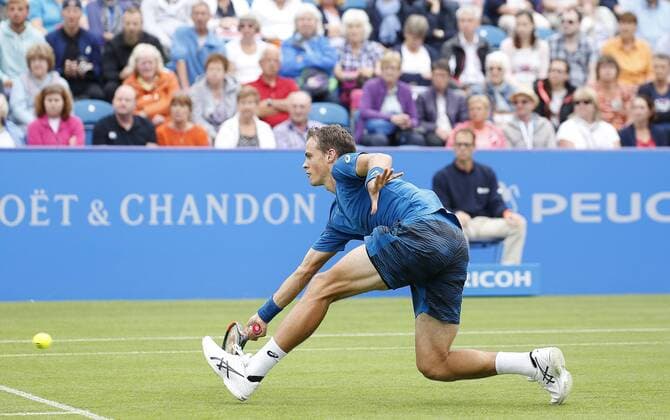 June 28th 2017, Devonshire Park, Eastbourne, England; Aegon International Eastbourne; ; Novak Djokovic (SRB) versus Vasek Pospisil (CAN); Pospisil digs out a low forehand; Djokovic won his 2nd round match 6-4 6-3 xHongboxChenx  ActionPlus11894964