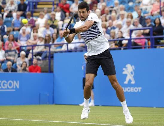 June 28th 2017, Devonshire Park, Eastbourne, England; Aegon International Eastbourne; ; Novak Djokovic (SRB) versus Vasek Pospisil (CAN); Djokovic hits a backhand as he wins his 2nd round match 6-4 6-3 xHongboxChenx  ActionPlus11894946