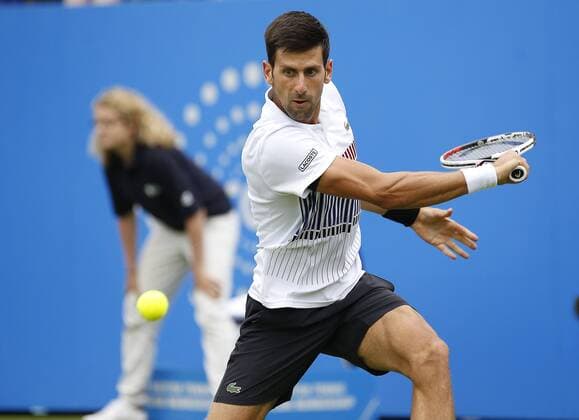 June 28th 2017, Devonshire Park, Eastbourne, England; Aegon International Eastbourne; ; Novak Djokovic (SRB) versus Vasek Pospisil (CAN); Djokovic hits a backhand as he wins his 2nd round match 6-4 6-3 xHongboxChenx  ActionPlus11894954