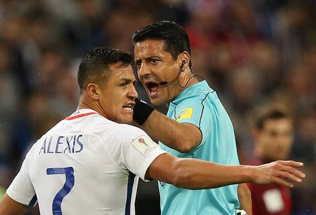 KAZAN, RUSSIA - JUNE 28, 2017: Chile s Alexis Sanchez (L) argues with referee Alireza Faghani during the 2017 FIFA Confederations Cup semifinal football match against Portugal at Kazan Arena Stadium. Yegor Aleyev TASS  TS055476