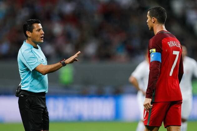 Portugal vs Chile KAZAN, RT - 28.06.2017: PORTUGAL VS CHILE - The referee of the match, Alireza FAGHANI (IRN) of the fight in CRISTIANO RONALDO of Portugal during match between Portugal and Chile valid for the semifinal of the Confederations Cup 2017, this Wednesday (28), held in Arena Kazan, Kazan, Russia . (Photo: Marcelo Machado de Melo Fotoarena) x1346286x  MarceloxMachadoxdexMelo