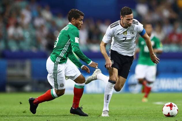 Germany vs Mexico SOCHI, SC - 29.06.2017: GERMANY VS MEXICO - Julian Draxler of Germany is bidding with Mexico& 39;s Jonathan Dos Santos during a match between Germany and Mexico in the semifinals of the 2017 FIFA Confederns Cup on Thn Thursday at the Sochi Olympic Stadium in Sochi, Russia. (Photo: Heuler Andrey DiaEsportivo Fotoarena) x1347264x  HeulerxAndrey