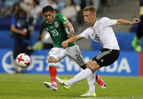 Germany vs Mexico SOCHI, SC - 29.06.2017: GERMANY VS MEXICO - AQUINO Javier of Mexico plays the ball with Joshua KIMMICH of Germany during a match between Germany and Mexico valid for the semifinals of the 2017 Confederations Cup on Thursday at the Sochi Olympic Stadium in Sochi, Russia. (Photo: Rodolfo Buhrer La Imagem Fotoarena) x1347310x  RodolfoxBuhrer