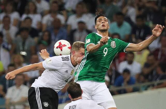 SOCHI, RUSSIA - JUNE 29, 2017: Germany s Matthias Ginter (L) and Mexico s Raul Jimenez fight for the ball in their 2017 FIFA Confederations Cup semifinal football match at Fisht Stadium. Artyom Korotayev TASS  TS0557FB