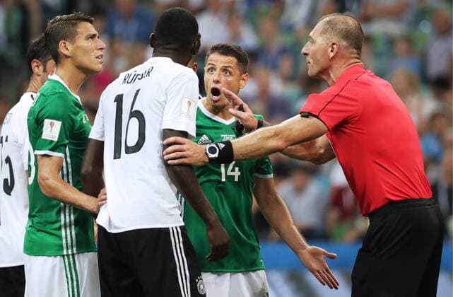 SOCHI, RUSSIA - JUNE 29, 2017: Mexico s Hector Moreno, Germany s Antonio Ruediger, Mexico s Javier Hernandez, and referee Nestor Pitana (L-R) seen during their 2017 FIFA Confederations Cup semifinal football match at Fisht Stadium. Germany won the game 4-1. Artyom Korotayev TASS  TS055842
