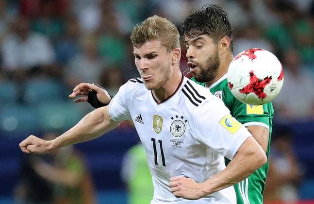 SOCHI, RUSSIA - JUNE 29, 2017: Germany s Timo Werner (L) and Mexico s Nestor Araujo fight for the ball in their 2017 FIFA Confederations Cup semifinal football match at Fisht Stadium. Germany won the game 4-1. Artyom Korotayev TASS  TS055847