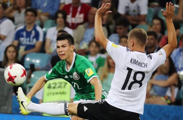 SOCHI, RUSSIA - JUNE 29, 2017: Mexico s Hirving Lozano (L) and Germany s Joshua Kimmich fight for the ball in their 2017 FIFA Confederations Cup semifinal football match at Fisht Stadium. Germany won the game 4-1. Artyom Korotayev TASS  TS05584A