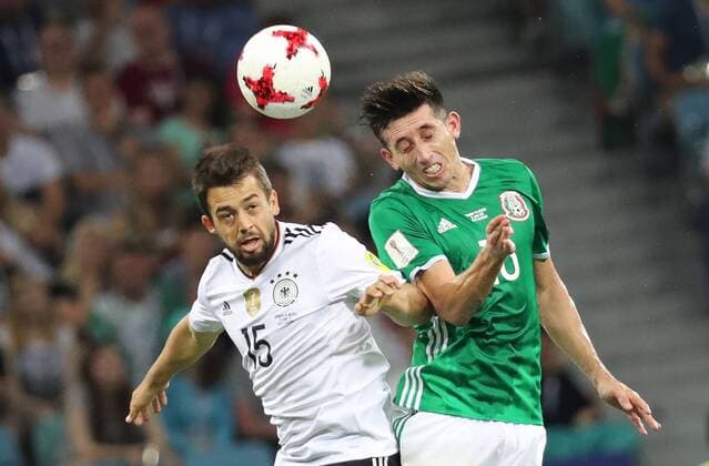 SOCHI, RUSSIA - JUNE 29, 2017: Germany s Amin Younes (L) and Mexico s Hector Herrera jump to head the ball in their 2017 FIFA Confederations Cup semifinal football match at Fisht Stadium. Germany won the game 4-1. Artyom Korotayev TASS  TS05584D