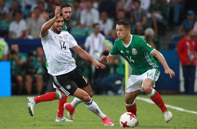 SOCHI, RUSSIA - JUNE 29, 2017: Germany s Emre Can (L) and Mexico s Javier Hernandez fight for the ball in their 2017 FIFA Confederations Cup semifinal football match at Fisht Stadium. Germany won the game 4-1. Sergei Fadeichev TASS  TS05585A