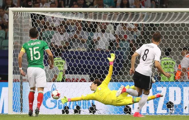 (170630) -- SOCHI, June 30, 2017 -- Leon Goretzka (R) of Germany scores their first goal as Mexico s goalkeeper Guillermo Ochoa (C) fails to save the ball during the semifinal match of the 2017 FIFA Confederations Cup in Sochi, Russia, June 29, 2017. Germany won 4-1. ) (SP)RUSSIA-SOCHI-2017 FIFA CONFEDERATIONS CUP-SEMIFINAL-GER VS MEX XuxZijian 