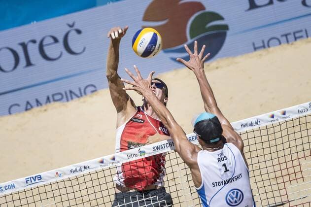 POREC, CROATIA - JULY 01: Oleg Stoyanovskiy of Russia competing against Jakub Szalankiewicz of Polska during the Swatch Beach volleyball Beachvolleyball Major Series 2017 on July 1, 2017 in Porec, Croatia. (Photo by Mihai Stetcu Hoch Zwei) Porec Croatia xHOCHxZWEIx