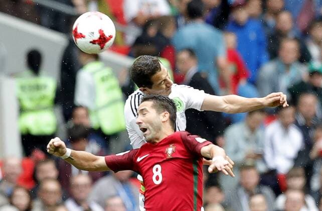 MOSCOW, RUSSIA â€“ JULY 2, 2017: Portugal s Joao Moutinho (front) and Mexico s Andres Guardado struggle for the ball in their 2017 FIFA Confederations Cup third place football match at Otkrytie Arena. Mikhail Japaridze TASS  TS055C47