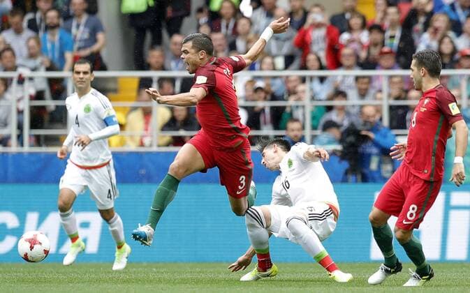 MOSCOW, RUSSIA â€“ JULY 2, 2017: Portugal s Pepe (2nd L), Joao Moutinho (R), and Mexico s Hector Herrera struggle for the ball in their 2017 FIFA Confederations Cup third place football match at Otkrytie Arena. Mikhail Japaridze TASS  TS055C48